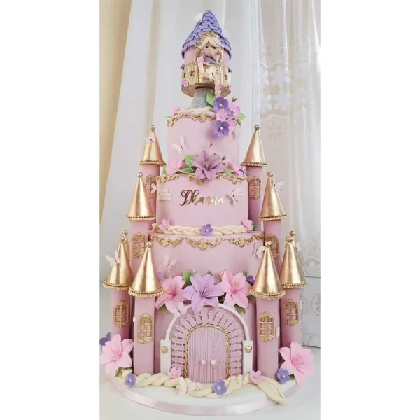 5-tier Rapunzel castle cake with golden turrets, pink fondant, floral details, and Rapunzel topper