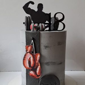 Fitness GYM birthday cake with boxing gloves, dumbbells, and muscular silhouette topper – custom cake for boys