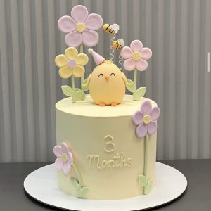 Cute Bird Cake with pastel flowers and bees – perfect for kids’ parties and celebrations