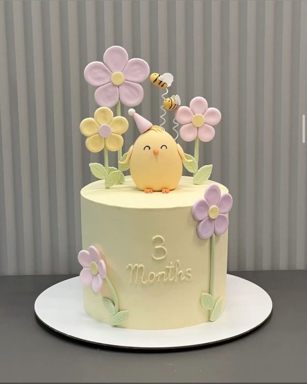 Cute Bird Cake with pastel flowers and bees – perfect for kids’ parties and celebrations