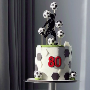Soccer Theme Cake with edible footballs, player silhouette topper, and number 80